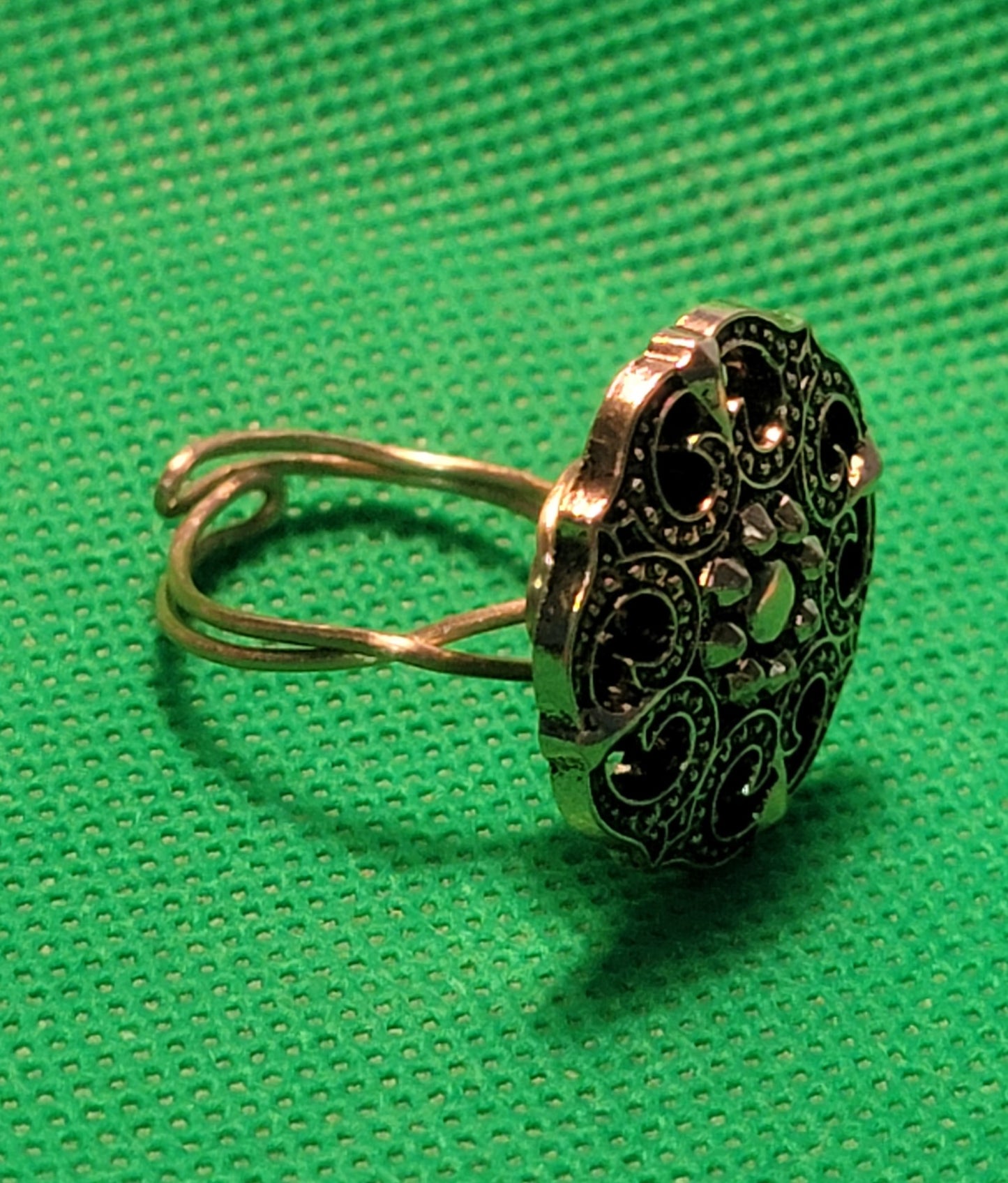 Gold colored metal button ring
