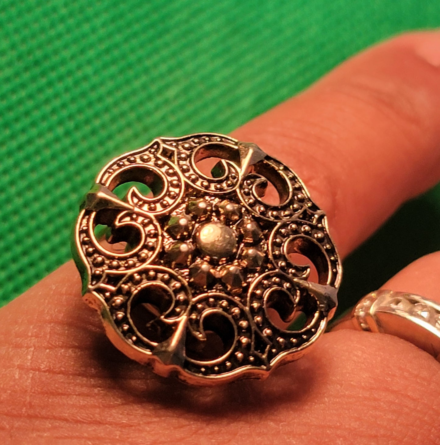 Gold colored metal button ring