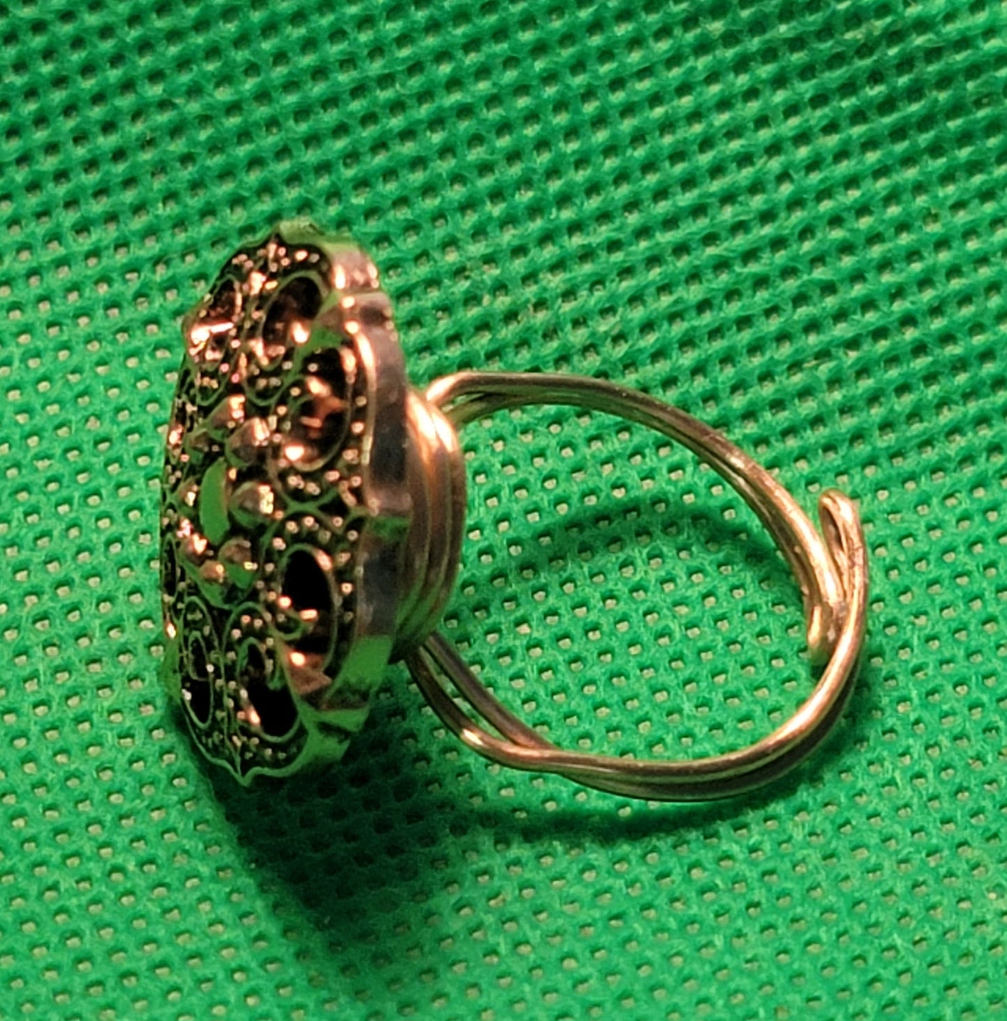Gold colored metal button ring