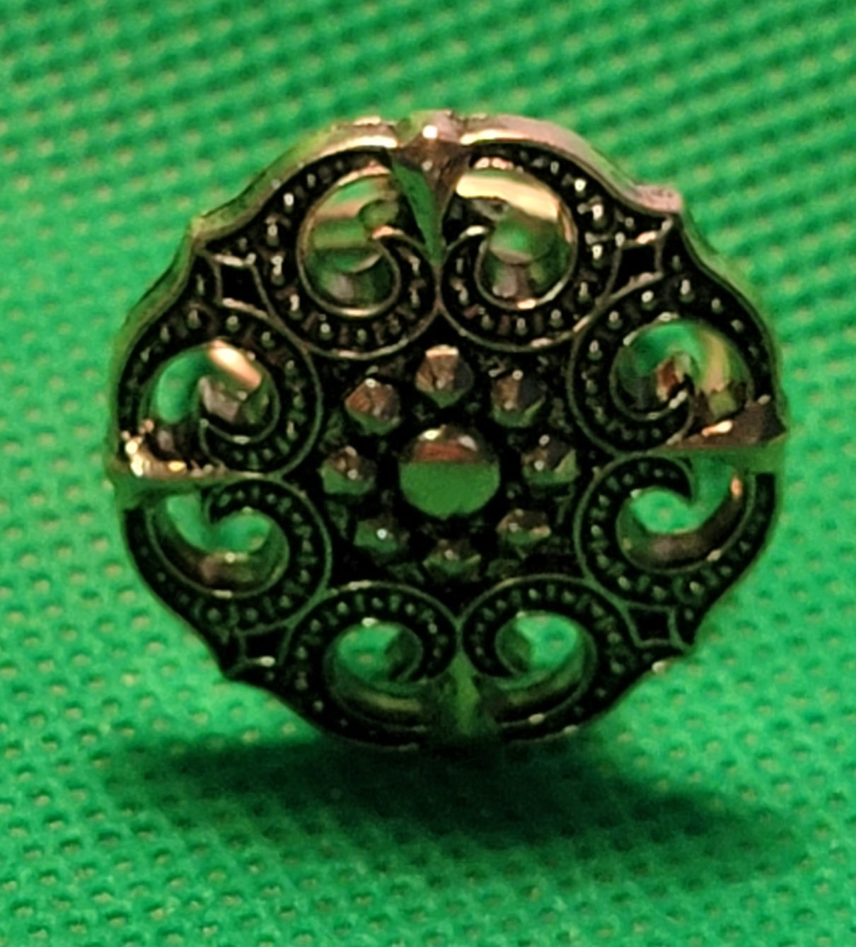 Gold colored metal button ring