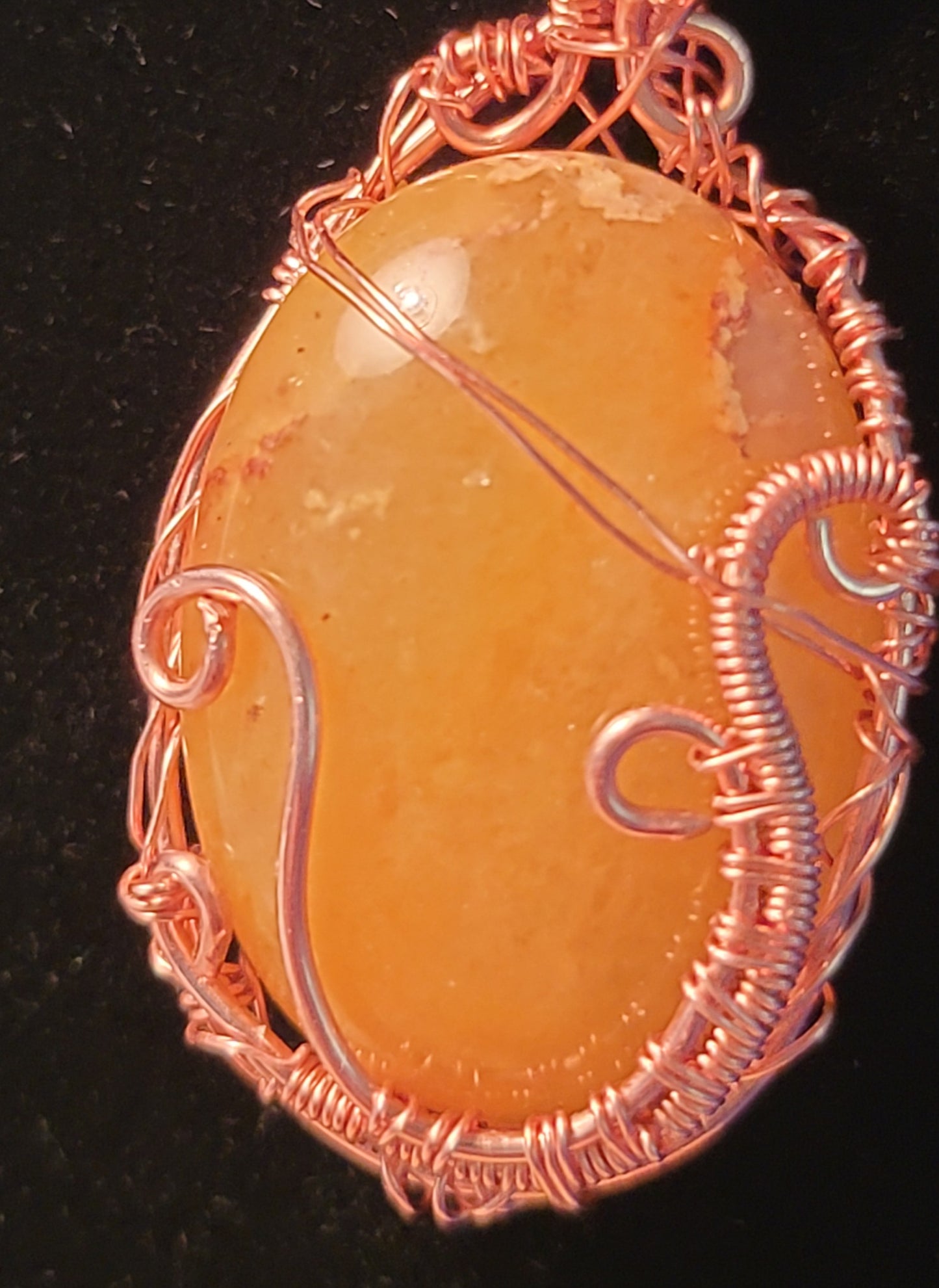 Wire wrapped carbochon pendant.