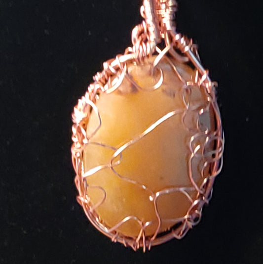 Wire wrapped carbochon pendant.
