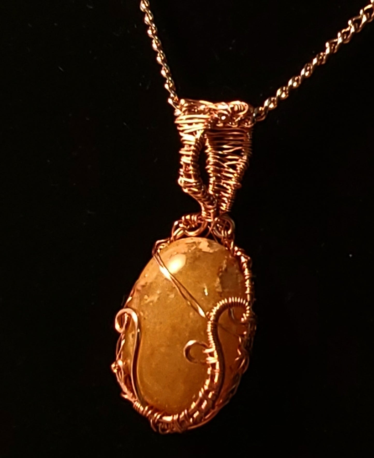 Wire wrapped carbochon pendant.