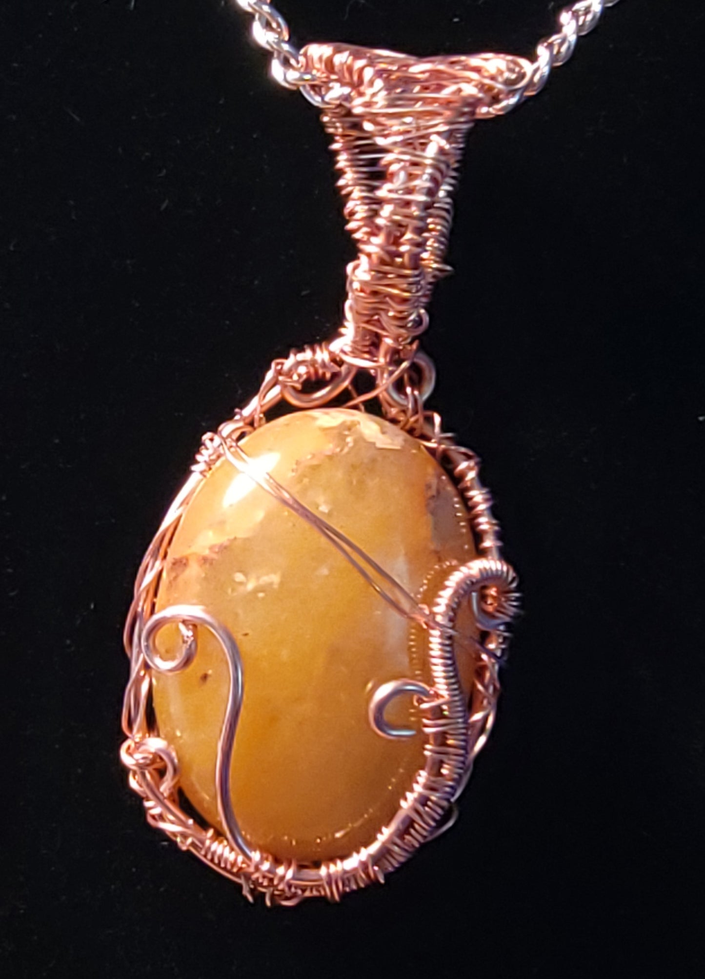 Wire wrapped carbochon pendant.